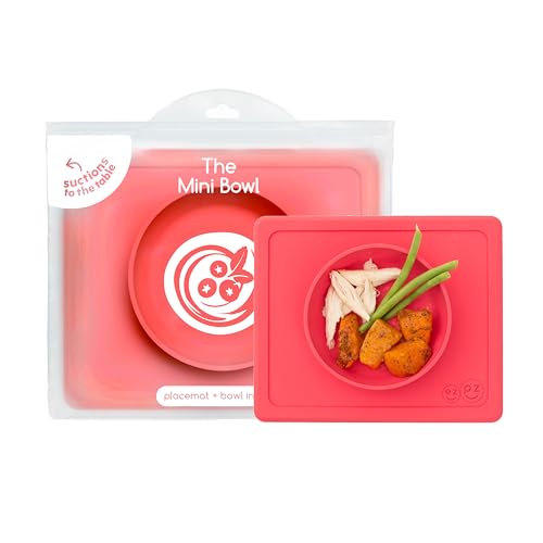 ezpz Mini Bowl for 12 Months+ (Coral) - 100% Silicone Suction Bowl with Built-in Placemat for Toddlers - Comes with a Reusable Travel Bag